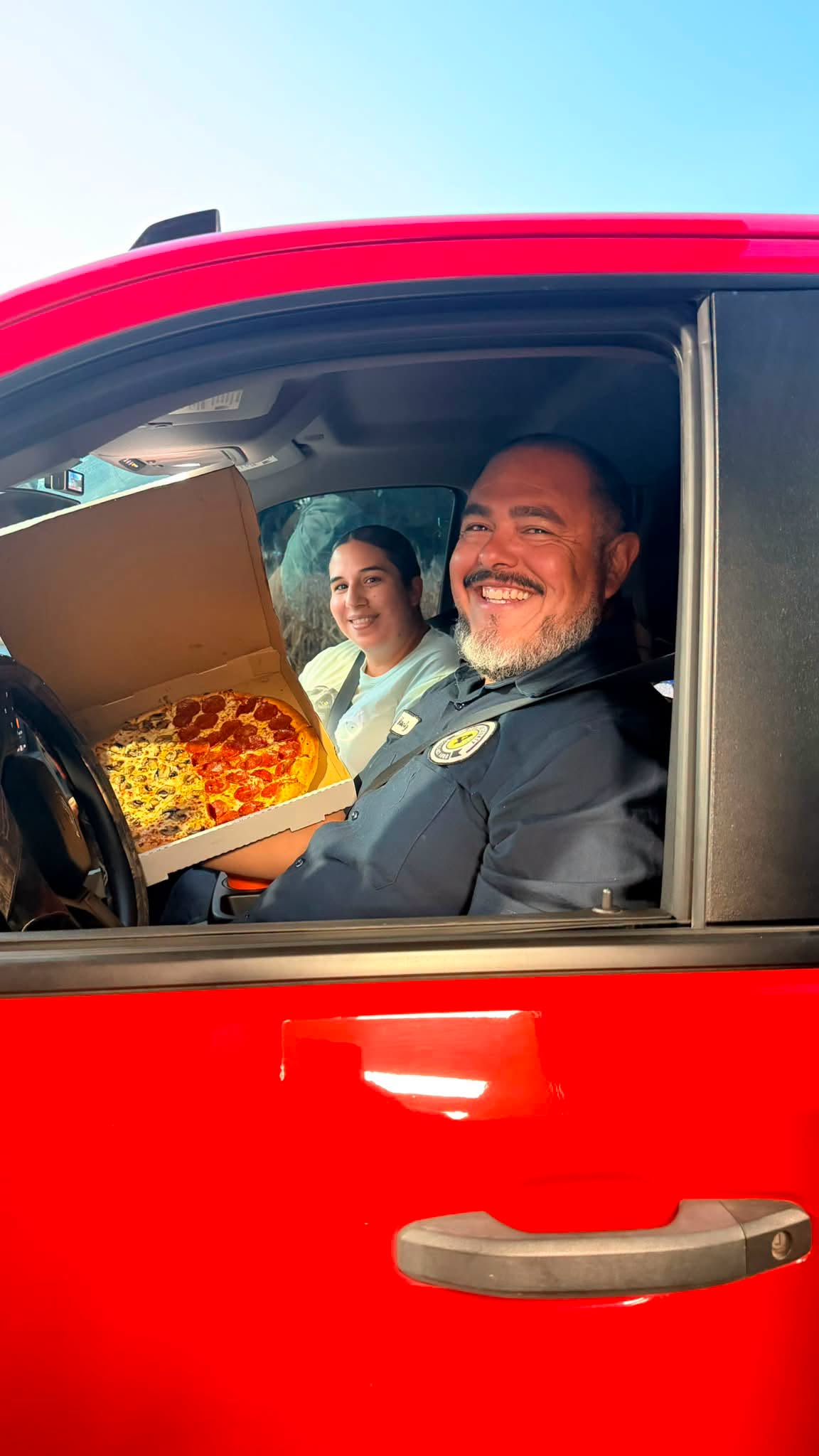We love to see the smiles when our customers get two pizzas in one!